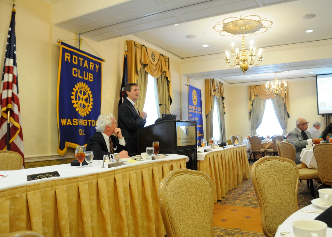 Dan Noble, U.S. Army Corps of Engineers Baltimore District project manager, spoke to the Rotary Club of Washington, D.C. June 18. Noble presented information on the Corps of Engineers 21-year history of work at the Spring Valley Formerly Used Defense Site in northwest Washington. Work has included removal of arsenic-contaminated soil, munitions removal and groundwater monitoring. Noble explained to the attendees that the Corps of Engineers will soon be presenting the draft remedial investigation report for public comment. This report will outline all of the work that has been done at the site and what further actions are proposed.  Shaun English, the club president, presented Noble with a certificate of appreciation, indicating the club will plant a tree in his honor as part of Trees for the Capital.  