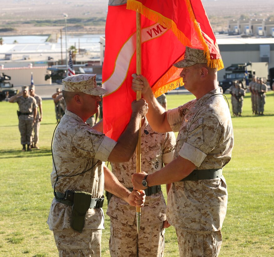 Lt. Col. John D. Thurman, former commanding officer, Unmanned Aerial Vehicle Squadron 3, relinquishes command to Lt. Col. Brynn H. Schreiner, commanding officer, VMU-3, during the squadron's change of command ceremony at Lance Cpl. Torrey L. Gray Field, June 18, 2014. Thurman served as the commanding officer for more than two years.