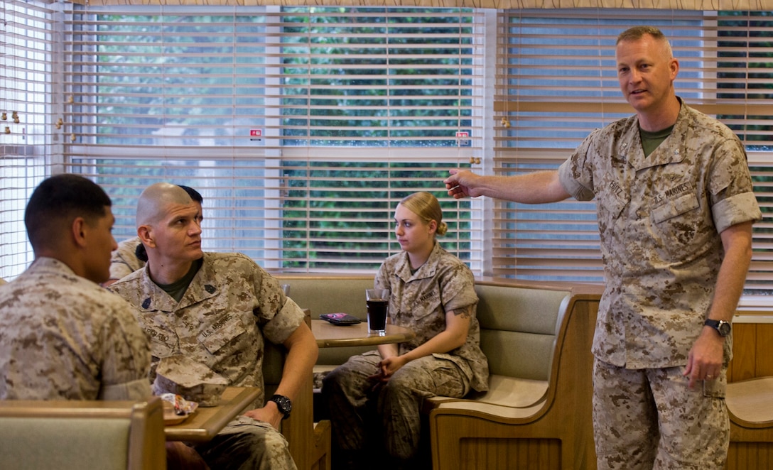 Lt. Col. Curtis V. Ebitz Jr., right, speaks with Marines assigned to Marine Wing Headquarters Squadron 1 during an open discussion June 11 at the Camp Foster Mess Hall. Ebitz holds monthly meetings to discuss questions junior Marines might have about policies, potential changes, upcoming events, and how to be an effective leader. Ebitz is a Homosassa, Florida, native and the commanding officer of MWHS-1, 1st Marine Aircraft Wing, III Marine Expeditionary Force. (U.S. Marine Corps photo by Lance Cpl. Diamond N. Peden/Released)