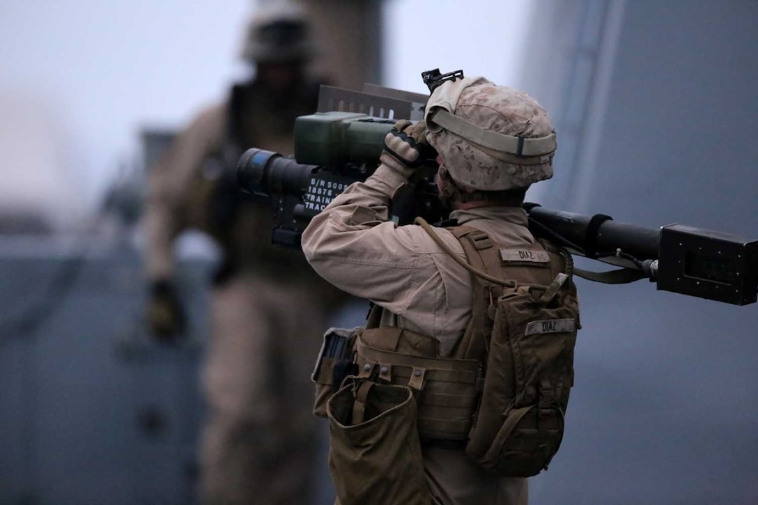 A Marine with 3rd Low Altitude Air Defense (LAAD) Detachment, 11th Marine Expeditionary Unit, mounts an FIM-92 Stinger missile launcher as part of a strait transit exercise conducted during Certification Exercise (CERTEX) off the coast of Southern California, June 14, 2014. CERTEX is comprised of a specific series of missions intended to evaluate and certify the 11th MEU for their upcoming deployment with the Makin Island Amphibious Ready Group scheduled for later this summer. (U.S. Marine Corps photo by Gunnery Sgt. Rome M. Lazarus/Released)