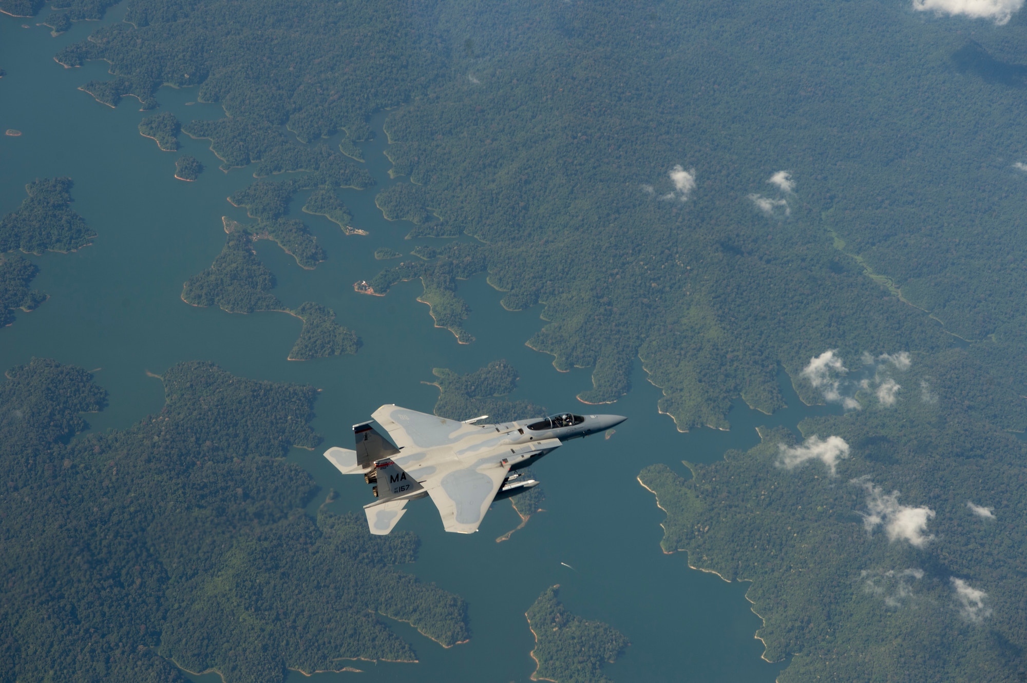 A U.S. Air Force F-15 Eagle from the 131st Fighter Squadron, 104th Fighter Wing, Barnes Air National Guard Base, Mass., flies over Penang, Malaysia, during Cope Taufan 14, June 18, 2014. Cope Taufan is a biennial large force employment exercise taking place June 9 to 20 designed to improve U.S. and Malaysian combined readiness. (U.S. Air Force photo by Tech. Sgt. Jason Robertson/Released) 