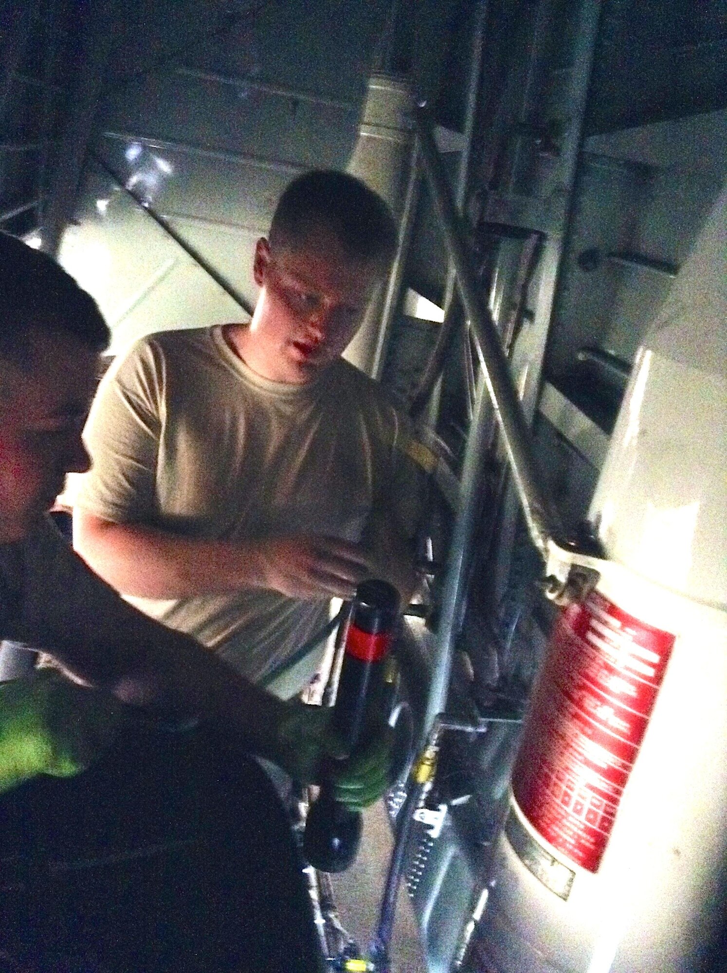 Staff Sgt. Scott Thompson, 374th Maintenance Squadron pneudraulics section NCO in charge, performs maintenance on a C-130 Herculese at Yokota Air Base, Japan. (Courtesy photo)