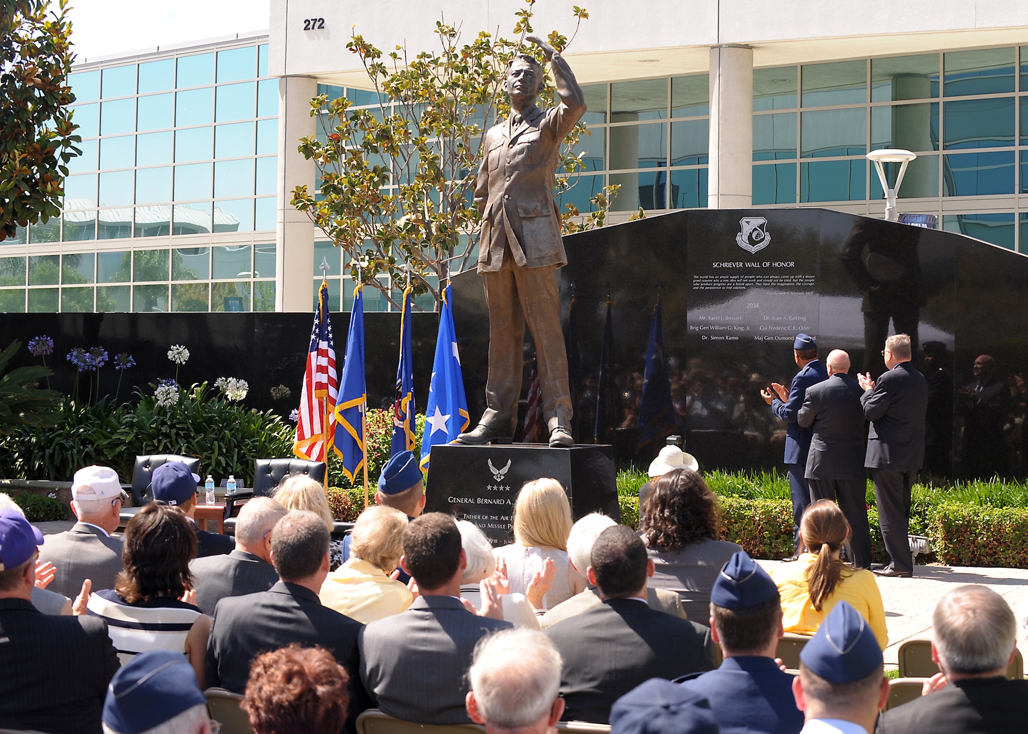 Lt. Gen. Samuel Greaves, SMC commander, and Retired Maj. Gen. Thomas Taverney, AFA General Schriever Chapter chairman, unveil the first names carved on the Space Wall of Honor at a ceremony held here, June 19. (Photo by Joe Juarez)