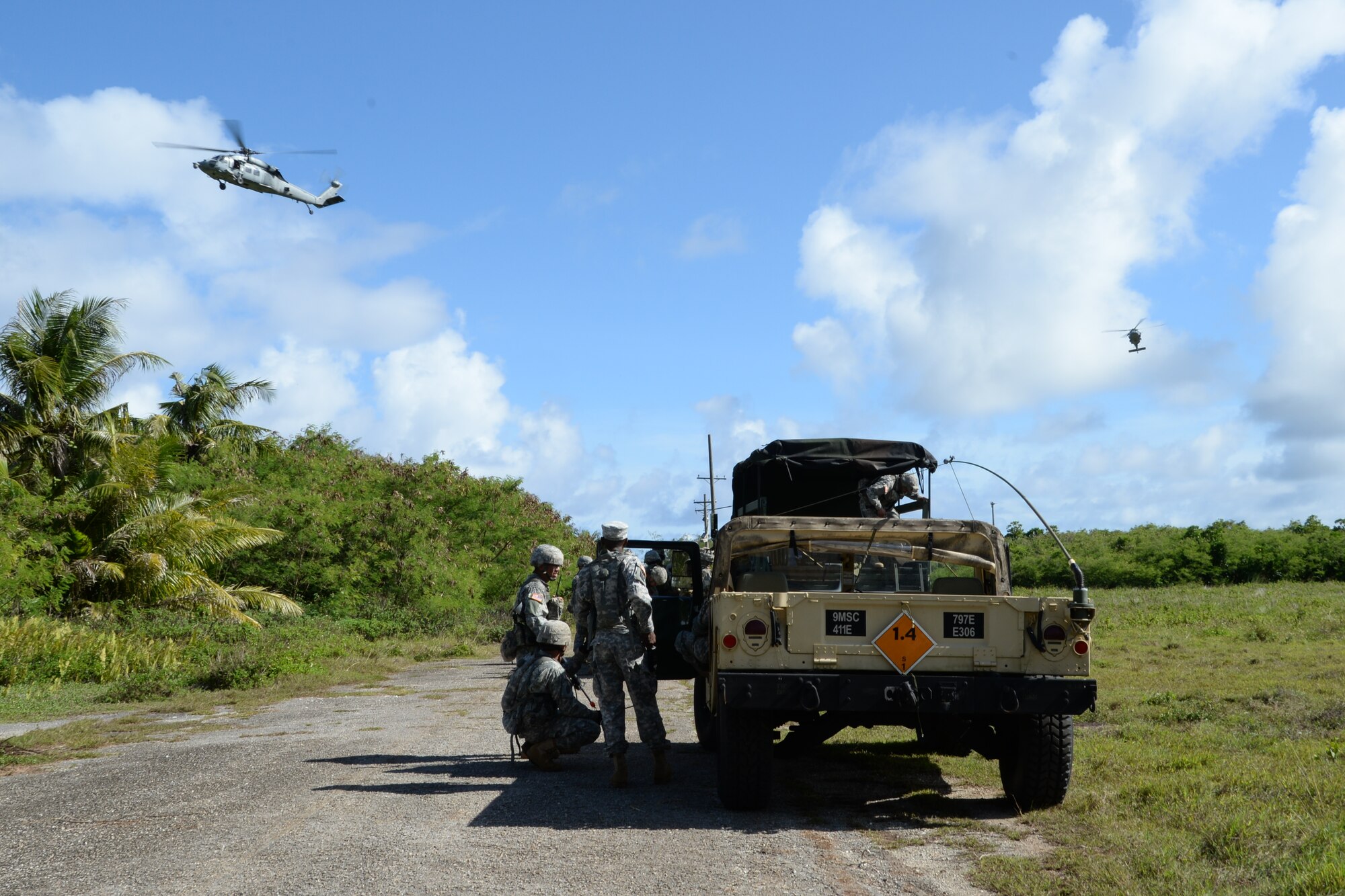 The U.S. Army Reserve 797th Engineer Company (Vertical) prepare for a medical evacuation during a training exercise June 11, 2014, on Andersen South, Guam. The training consisted of classroom instruction, demonstrations and scenario-based training conducted alongside members of the U.S.  Navy Helicopter Sea Combat Squadron 25 based at Andersen Air Force Base, Guam. (U.S. Air Force photo by Airman 1st Class Amanda Morris/Released)