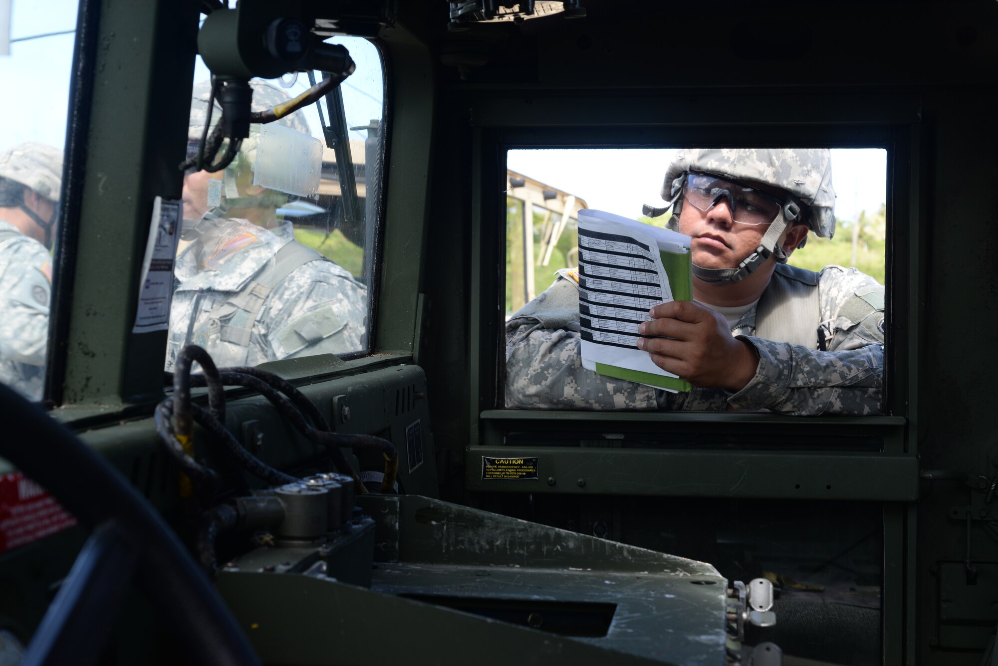 U.S. Army Reserve 1st Lt. George Sablan, 797th Engineer Company (Vertical) company commander, reviews a schedule while observing a training exercise June 11, 2014, on Andersen South, Guam. The training was held to improve the soldiers’ skills for contingencies in a variety of combat scenarios. (U.S. Air Force photo by Airman 1st Class Amanda Morris/Released)