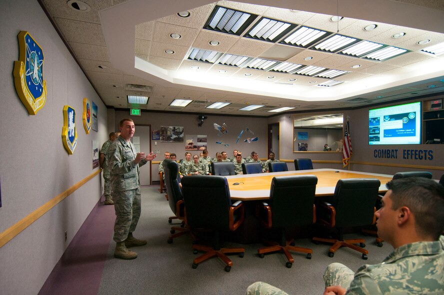Lt. Col. Matthew Cantore, 3rd Space Experimentation Squadron commander, briefs U.S. Air Force Academy cadets about the 50th Space Wing mission June 16, 2014 at Schriever Air Force Base, Colo. This event is part one of the Academy summer space seminar to learn about potential careers in the space community. (U.S. Air Force photo/Senior Airman Naomi Griego)    