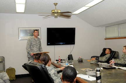 Chaplain (Maj). James Anderson, 502nd Air Base Wing branch chief for technical training, instructs a SafeTALK Class, June 17. SafeTALK, which stands for suicide alertness for everyone tell, ask, listen and keep safe, is a suicide prevention program designed to provide Airmen, civilian and family members with the skills needed to identify people who might have thoughts of suicide and be able to connect them to suicide first aid intervention caregivers for assistance. (U.S. Air Force photo by Senior Airman Lynsie Nichols)