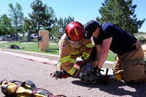 Firefighters respond to an incident as part of an exercise June 10, 2014, at Schriever Air Force Base, Colo. The exercise was designed to evaluate the base’s response to various incidents. (U.S. Air Force photo/Christopher DeWitt) 