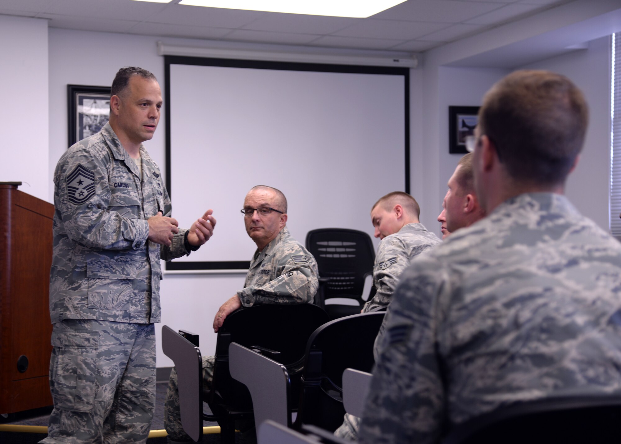 U.S. Air Force Chief Master Sgt. Matthew Caruso, Air Force Special
Operations Command command chief speaks to a group of Airmen at an open forum during his tour of the Airman Leadership School June 12, 2014, at Cannon Air Force
Base, N.M. Caruso made a point to interact with as many Cannon Air Commandos
as possible during his visit. (U.S. Air Force photo/Airman 1st Class Chip
Slack)
