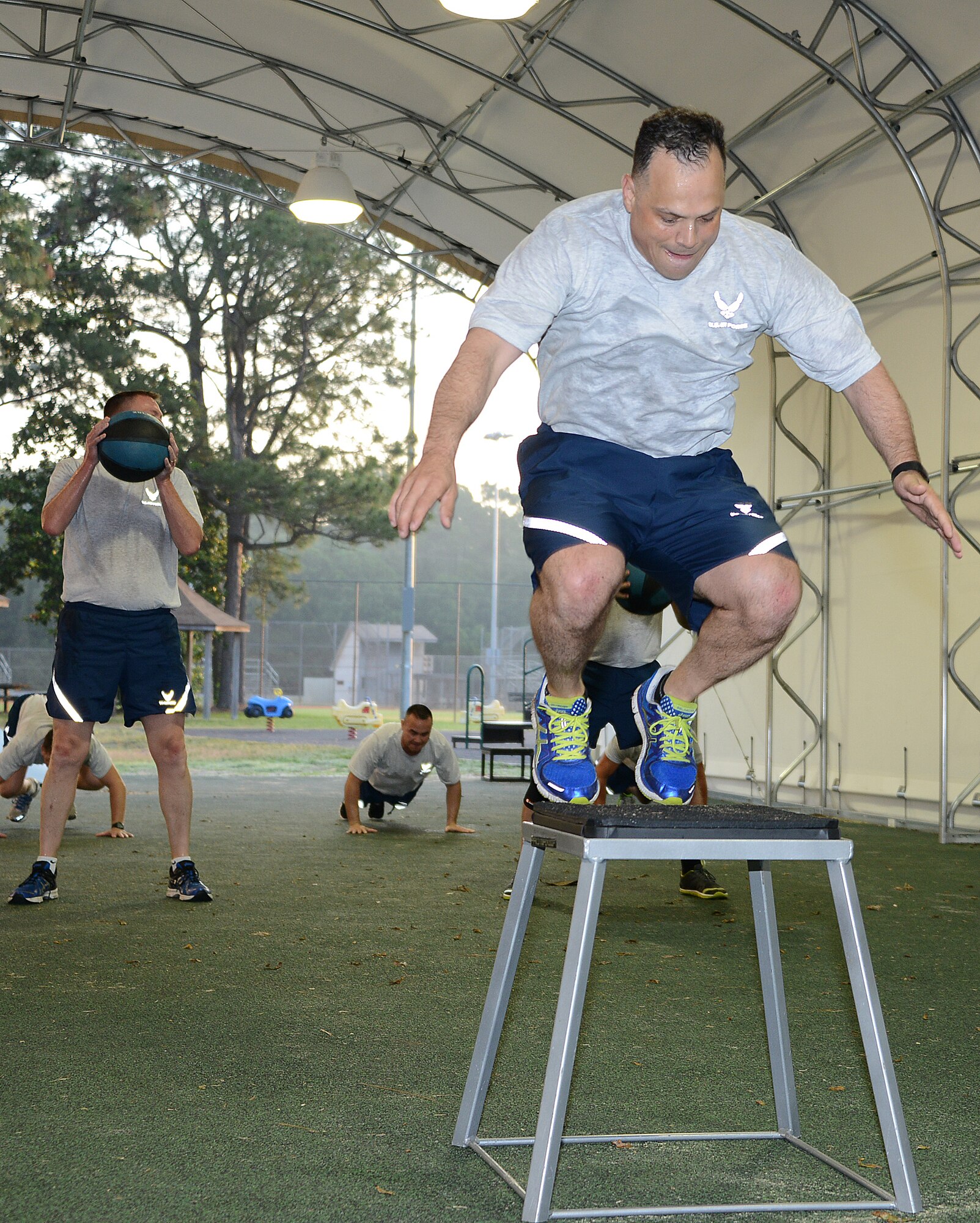 Chief Master Sgt. Matthew Caruso, command chief for Air Force Special Operations Command, works out with several enlisted leaders May 13, 2014, at Hurlburt Field's Aderholt Fitness Center track.  The chief is passionate about physical fitness and focused on improving fitness test scores command-wide.  (Air Force photo by Master Sgt. Steven Pearsall)