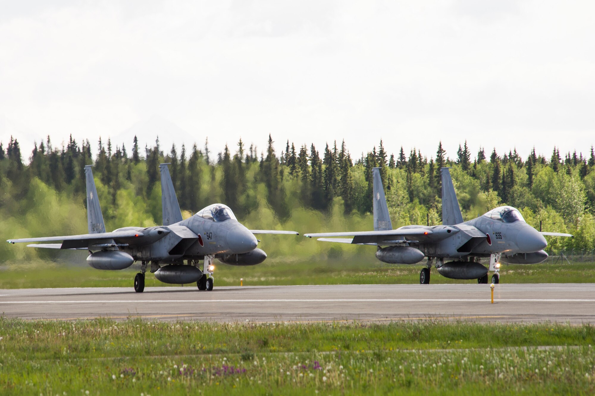 Two Japan Air Self Defense Force F-15 Eagles prepare to take off during RED FLAG-Alaska 14-2 June 16, 2014, Eielson Air Force Base, Alaska. RF-A is a realistic, 10-day air combat U. S. Air Force training exercise held annually at Eielson and Joint Base Elmendorf-Richardson Air Force Base, Alaska. (U.S. Air Force photo by Senior Airman Joshua Turner/Released)