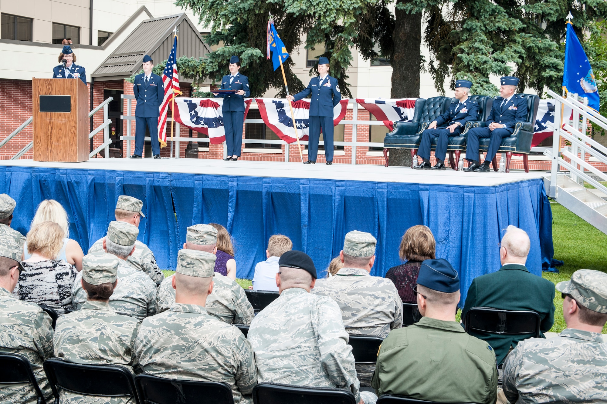 Col. Robin Schultze addresses members of the 92nd Medical Operations Squadron and Team Fairchild during the 92nd MDOS change of command ceremony at Fairchild Air Force Base, Wash., June 19, 2014. A change of command is a military tradition that represents a formal transfer and responsibility for a unit from one commanding officer to another. Schultze is the 92nd Medical Group commander. (U.S. Air Force photo by Staff Sgt. Benjamin W. Stratton/Released)