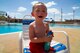 Ryland Moody, 3-year-old son of Staff Sgt. Ryan Moody, from the 49th Materiel Maintenance Squadron, electrical power production craftsman applies sunscreen before jumping in the pool at Holloman Air Force Base, N.M., June 12.  Because of high temperatures during the summer months in New Mexico, Team Holloman members are encouraged to use protective measures such as applying sunscreen and staying hydrated, while enjoying outdoor activities. (U.S. Air Force photo by Airman 1st Class Leah Ferrante/Released)