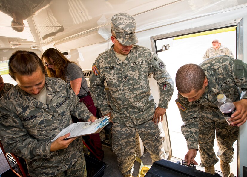 New York National Guard 2nd Squadron, 101st Cavalry members are instructed by 914th Airlift Wing personnel on how to weigh, measure and secure deployable equipment for airlift during a joint training exercise, June 07, 2014, Niagara Falls Air Reserve Station, NY. Exercises like this highlight the importance of interoperability between branches in a joint environment. (U.S. Air Force photo by Tech. Sgt. Joseph McKee)