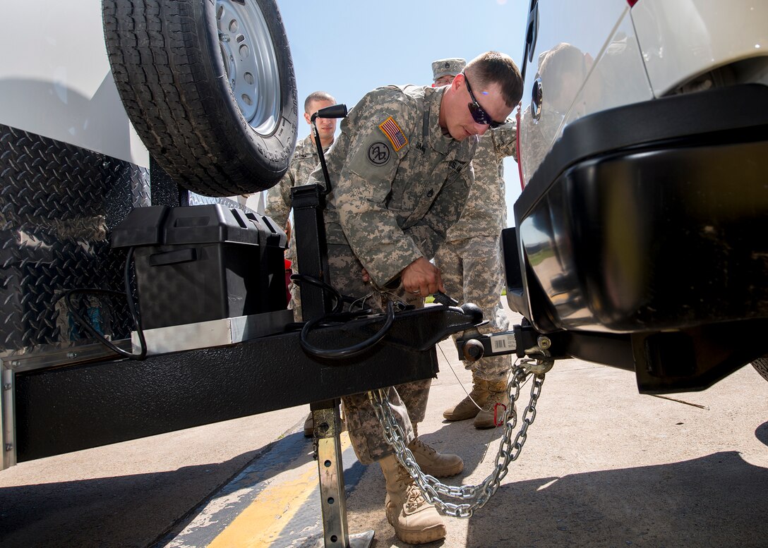 New York National Guard 2nd Squadron, 101st Cavalry members are instructed by 914th Airlift Wing personnel on how to weigh, measure and secure deployable equipment for airlift during a joint training exercise, June 07, 2014, Niagara Falls Air Reserve Station, NY. Exercises like this highlight the importance of interoperability between branches in a joint environment. (U.S. Air Force photo by Tech. Sgt. Joseph McKee)