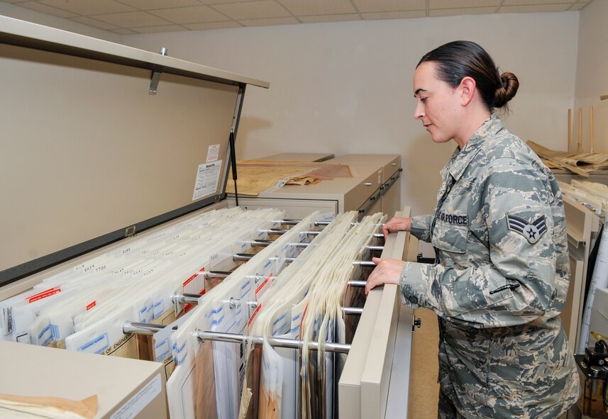 Senior Airman Callie Ware, 2nd Civil Engineer Squadron Technical Support engineering journeyman, opens an archive of maps and floor plans on Barksdale Air Force Base La., June 17, 2014. The archives contain information that may be provided to base personnel depending on their needs. Some information dates back to the 1930s. (U.S. Air Force Photo/Airman 1st Class Benjamin Raughton)