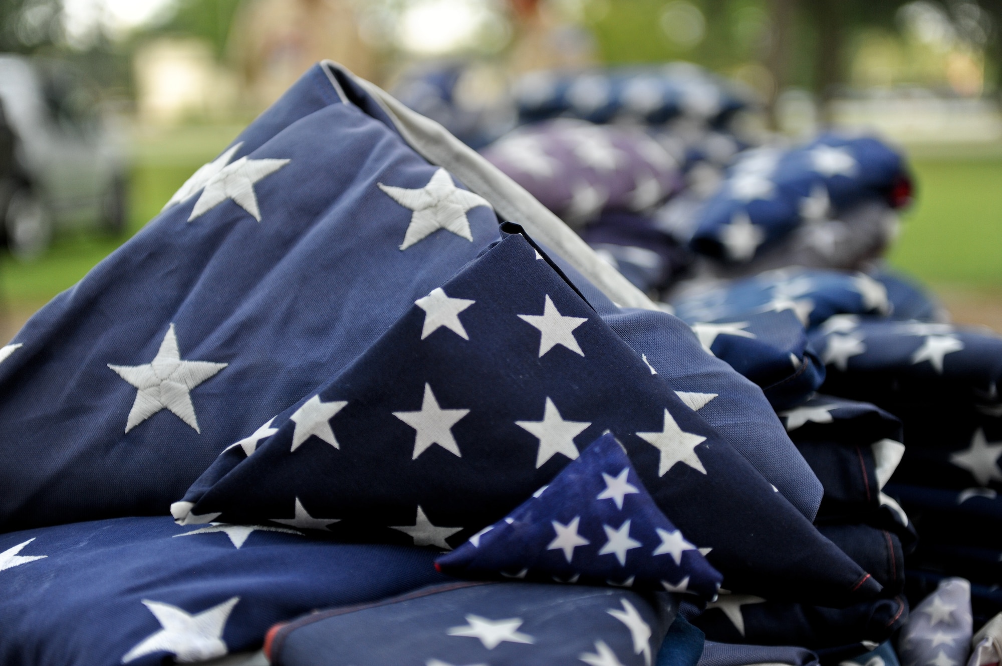 More than 100 flags are prepared for a flag retirement ceremony June 14, 2014, at Seymour Johnson Air Force Base, North Carolina. The flags were collected by local Boy Scouts and 4th Fighter Wing honor guardsmen. (U.S. Air Force photo/Airman 1st Class Aaron J. Jenne)