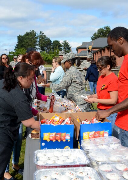 The 100th Communications Squadron hosted a Hearts Apart event for families of deployed Airmen June 18, 2014, at Heritage Park on RAF Mildenhall, England. The Hearts Apart dinner is a way for spouses and family members of deployed Airmen to gather together and network. (U.S. Air Force photo/Airman 1st Class Victoria H. Taylor/Released)
