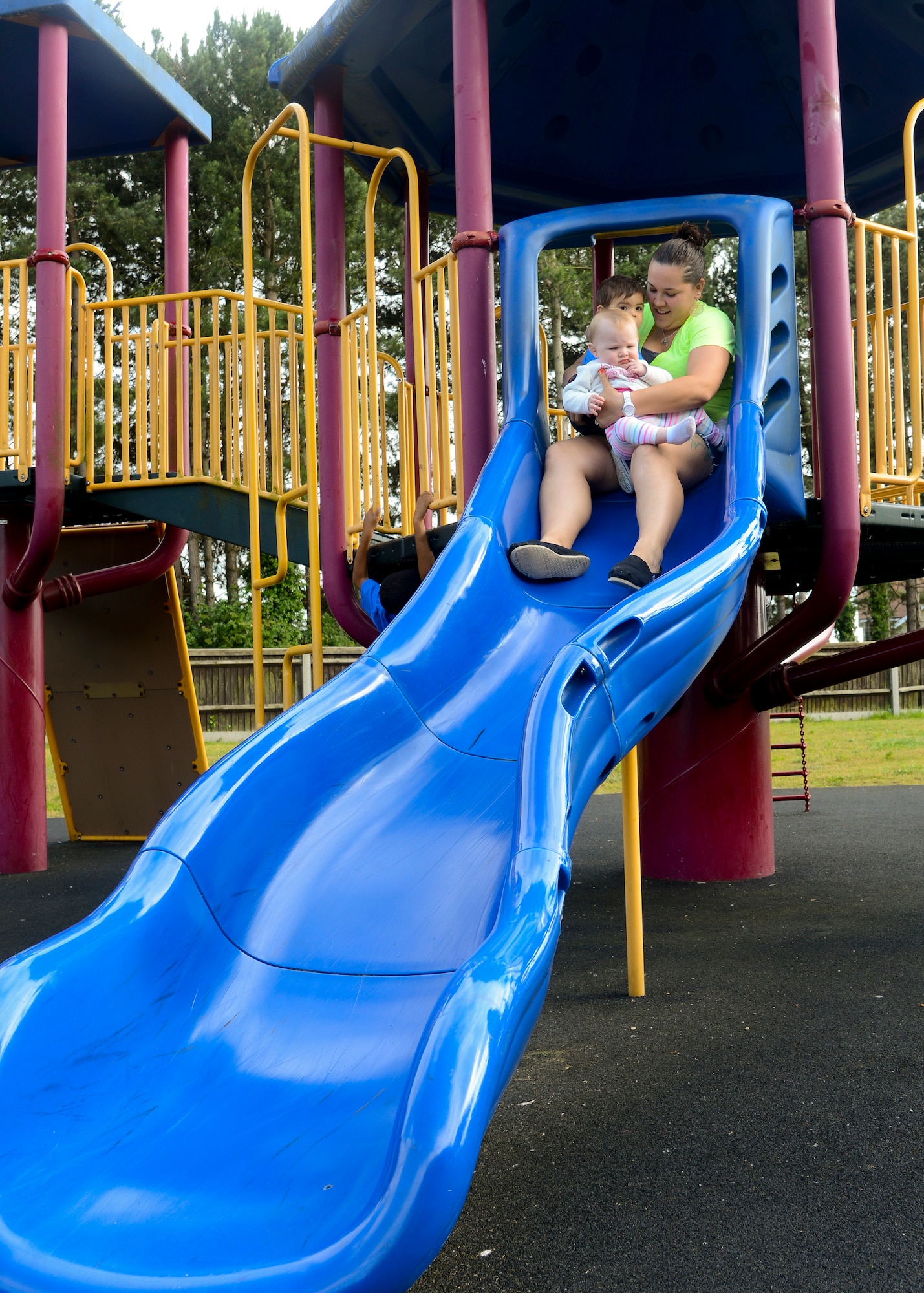 Team Mildenhall volunteers prepare food for families of deployed Airmen during a Hearts Apart event June 18, 2014, at Heritage Park on RAF Mildenhall, England. The 100th Communications Squadron hosted the event. (U.S. Air Force photo/Airman 1st Class Victoria H. Taylor/Released)