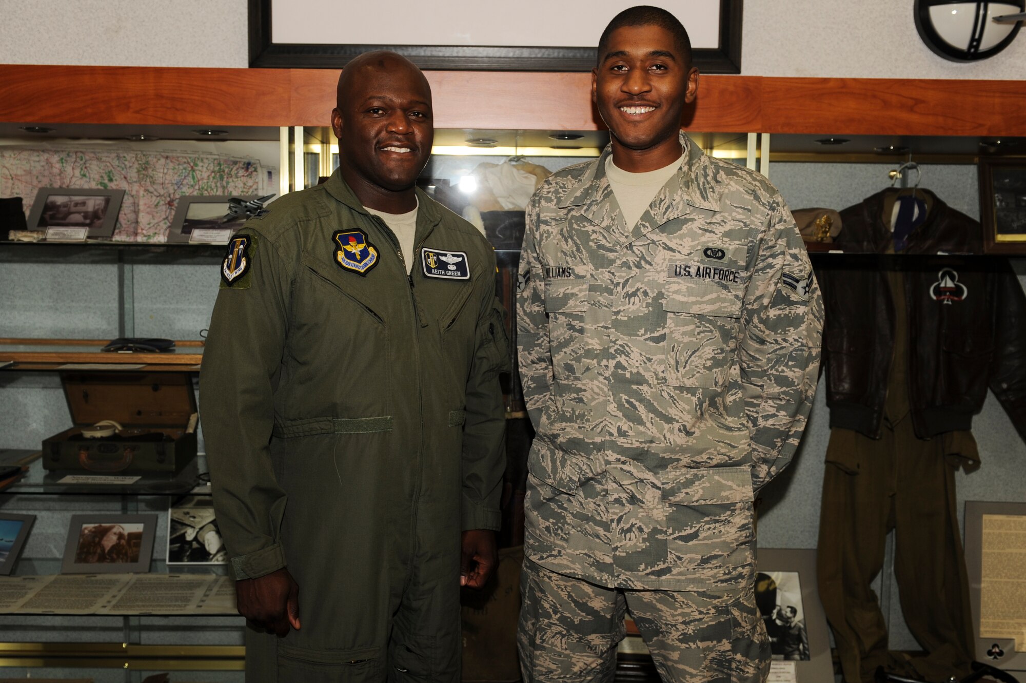 Col. Keith Green, 314th Airlift Wing vice commander, congratulates Airman 1st Class Vincent Williams, a 62nd Airlift Squadron aviation resource manager apprentice, for his selection of Combat Airlifter of the Week June 17, 2014, at Little Rock Air Force Base, Ark. Williams, a native of Dawson, Ga., was recognized for his instrumental performance through a mission review of 164 flight hours and training accomplishment reports for 243 aviators. (U.S. Air Force photo by Airman 1st Class Cliffton Dolezal) 