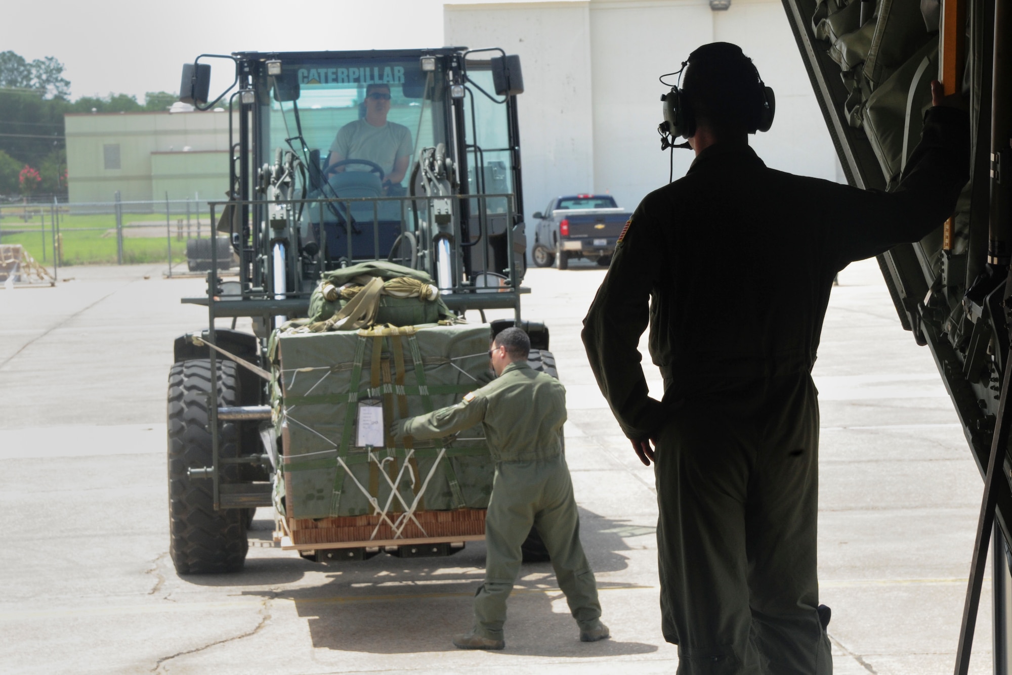 Tech. Sgt. Brian Digsby, a 34th Combat Training Squadron loadmaster, guides a pallet into the back of a C-130J in support of Green Flag Little Rock June 16, 2014, at Fort Polk, La. Green Flag Little Rock is a mobility air forces exercise that provides training for aircrews in support of Army exercises. (U.S. Air Force photo by Senior Airman Kaylee Clark)