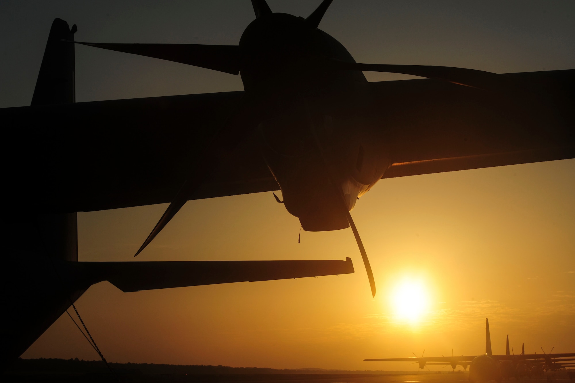 The sun rises over the flightline June 16, 2014 at Little Rock Air Force Base, Ark. Little Rock AFB is the home of combat airlift with more than 80 C-130s assigned.  (U.S. Air Force photo by Senior Airman Kaylee Clark)