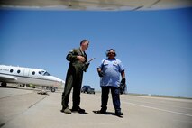 Capt. Richard Loesch III, 86th Flying Training Squadron instructor pilot, and Herman Hidalgo, 47th Maintenance Directorate aircraft servicer, conduct pre-flight procedures at the flight line on Laughlin Air Force Base, Texas, June 10, 2014. The purpose of a preflight inspection is not only to see that everything is attached to the airframe, but also ensure everything works. (U.S. Air Force photo/Staff Sgt. Steven R. Doty)(Released)