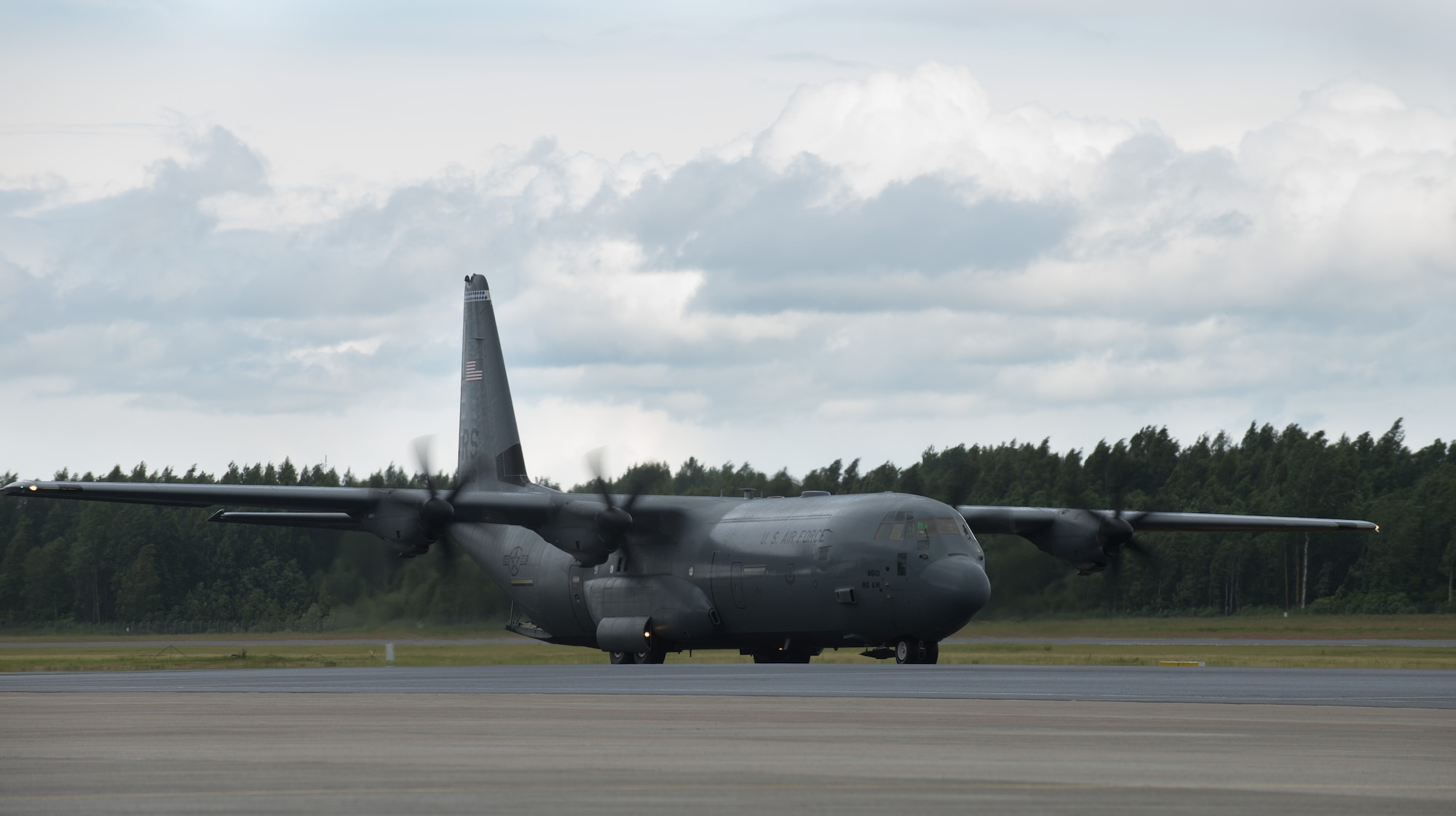 A C-130 J-model taxis into place at the Lielvarde Air Base, Latvia, June 17, 2014 in part of the exercise Saber Strike 2014. In total, three 37th AS airframes landed on Lielvarde, making them the first ever U.S. Air Force aircraft to land on the runway. The 37th AS aircraft brought approximately 92 Airmen from the 435th Contingency Response Group and equipment needed to build a bare base during the Air Force-specific training. (U.S. Air Force photo/Senior Airman Jonathan Stefanko)