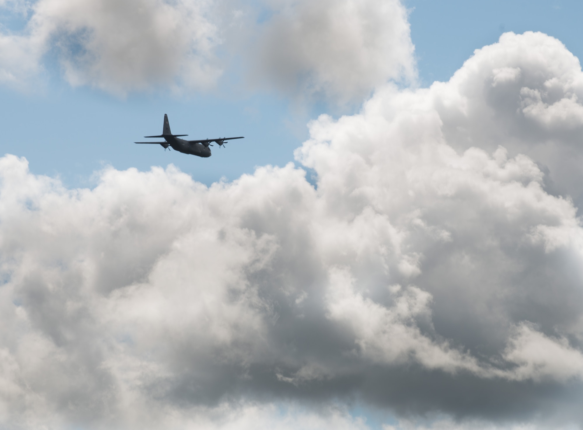 A C-130 J-model assigned to the 37th Airlift Squadron flies into clouds above Lielvarde Air Base, Latvia, June 17, 2014 in part of the exercise Saber Strike 2014. In total, three 37th AS airframes landed on Lielvarde, making them the first ever U.S. Air Force aircraft to land on the runway. The 37th AS aircraft brought approximately 92 Airmen from the 435th Contingency Response Group and equipment needed to build a bare base during the Air Force-specific training. (U.S. Air Force photo/Senior Airman Jonathan Stefanko)