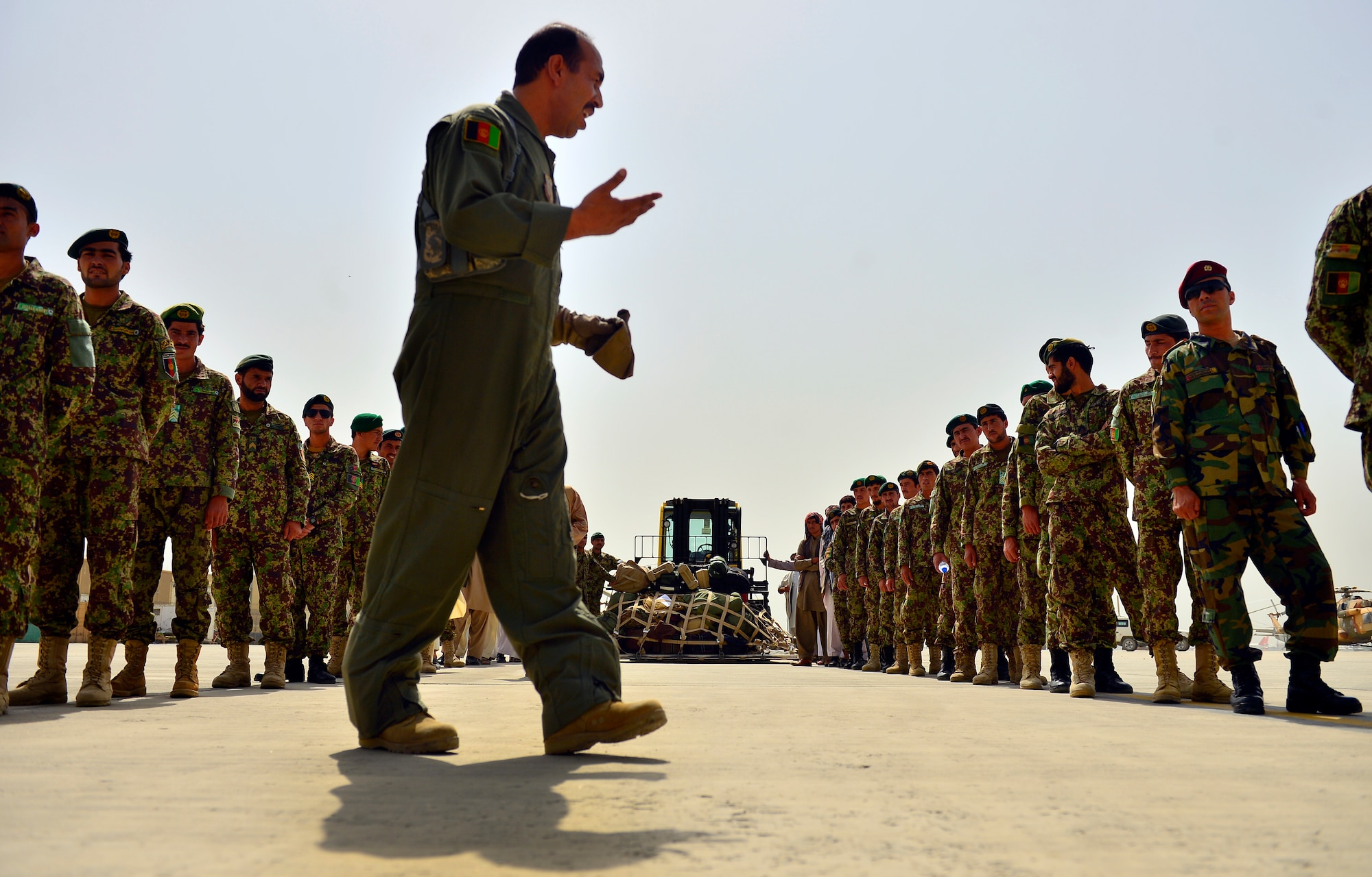 Afghan Air Force 1st Lt. , Shawanaz Nabi Zada, briefs Afghan National Army soldiers and other passengers prior to the first-ever all Afghan C-130 flight, Kabul, Afghanistan, June 16, 2014. The aircrew, made up of six AAF pilots and loadmasters, successfully completed a mission from Kabul to Kandahar and back. The aircrew successfully planned, executed and accounted for movement of about 120 Afghan personnel, two casualty evacuation patients, luggage and cargo in both directions. The ability for the AAF aircrew to move Afghan National Army Security Forces personnel, cargo, CASEVAC patients and human remains missions is a major accomplishment for both the AAF and NATO Air Training Command – Afghanistan advisors assigned to the 438th Air Expeditionary Wing. This milestone was accomplished eight months earlier than projected. (U.S. Air Force photo by Staff Sgt. Vernon Young Jr.)