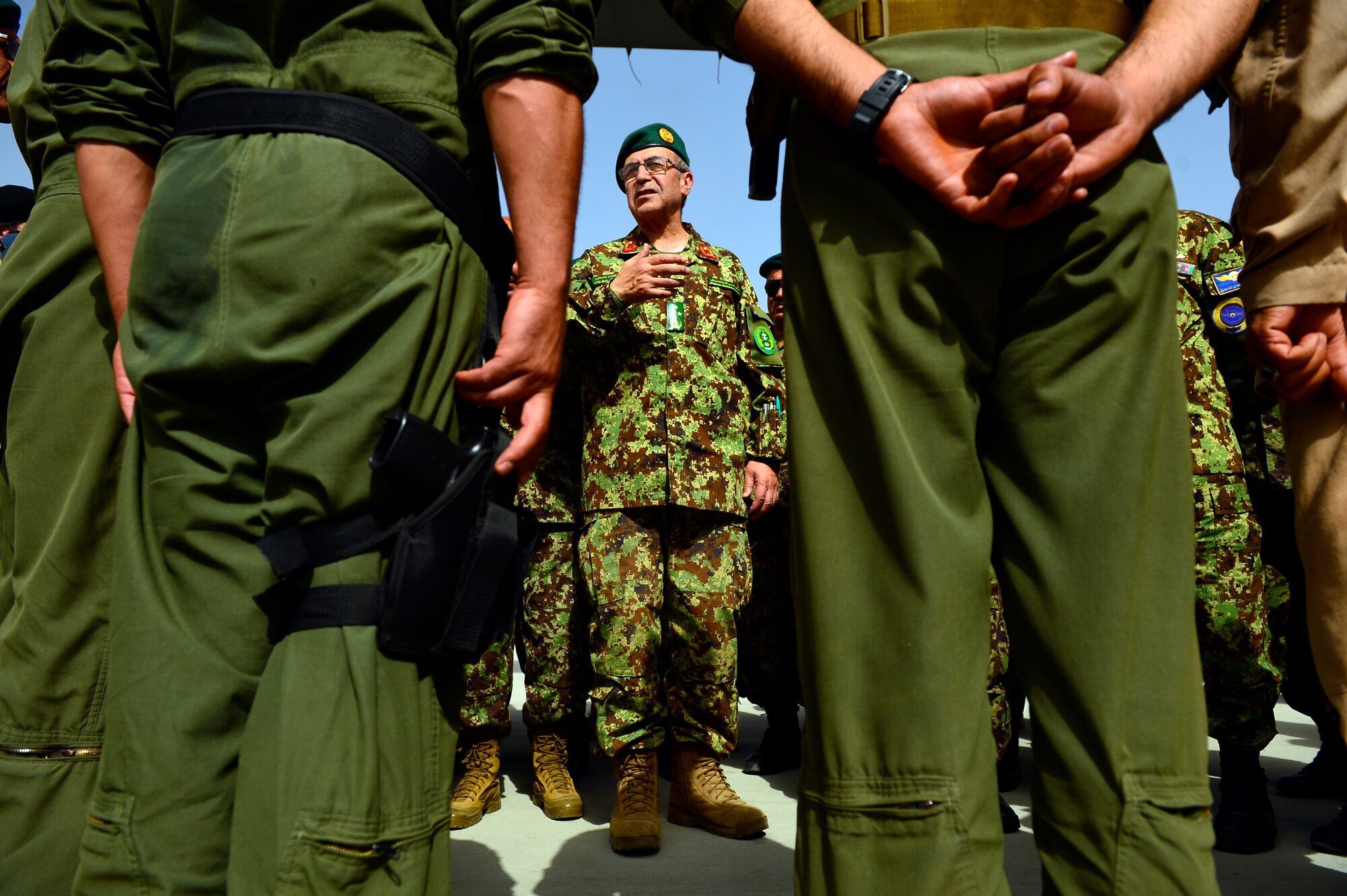 Lt. Gen. Mohammad Akram, Afghan National Army, Vice Chief of Staff, speaks to the aircrew after the first-ever all Afghan C-130 flight, Kabul, Afghanistan, June 16, 2014. The aircrew, made up of six Afghan Air Force pilots and loadmasters, successfully completed a mission from Kabul to Kandahar and back. The aircrew successfully planned, executed and accounted for movement of about 120 Afghan personnel, two casualty evacuation patients, luggage and cargo in both directions. The ability for the AAF aircrew to move Afghan National Army Security Forces personnel, cargo, CASEVAC patients and human remains missions is a major accomplishment for both the AAF and NATO Air Training Command – Afghanistan advisors assigned to the 438th Air Expeditionary Wing. This milestone was accomplished eight months earlier than projected. (U.S. Air Force photo by Staff Sgt. Vernon Young Jr.)