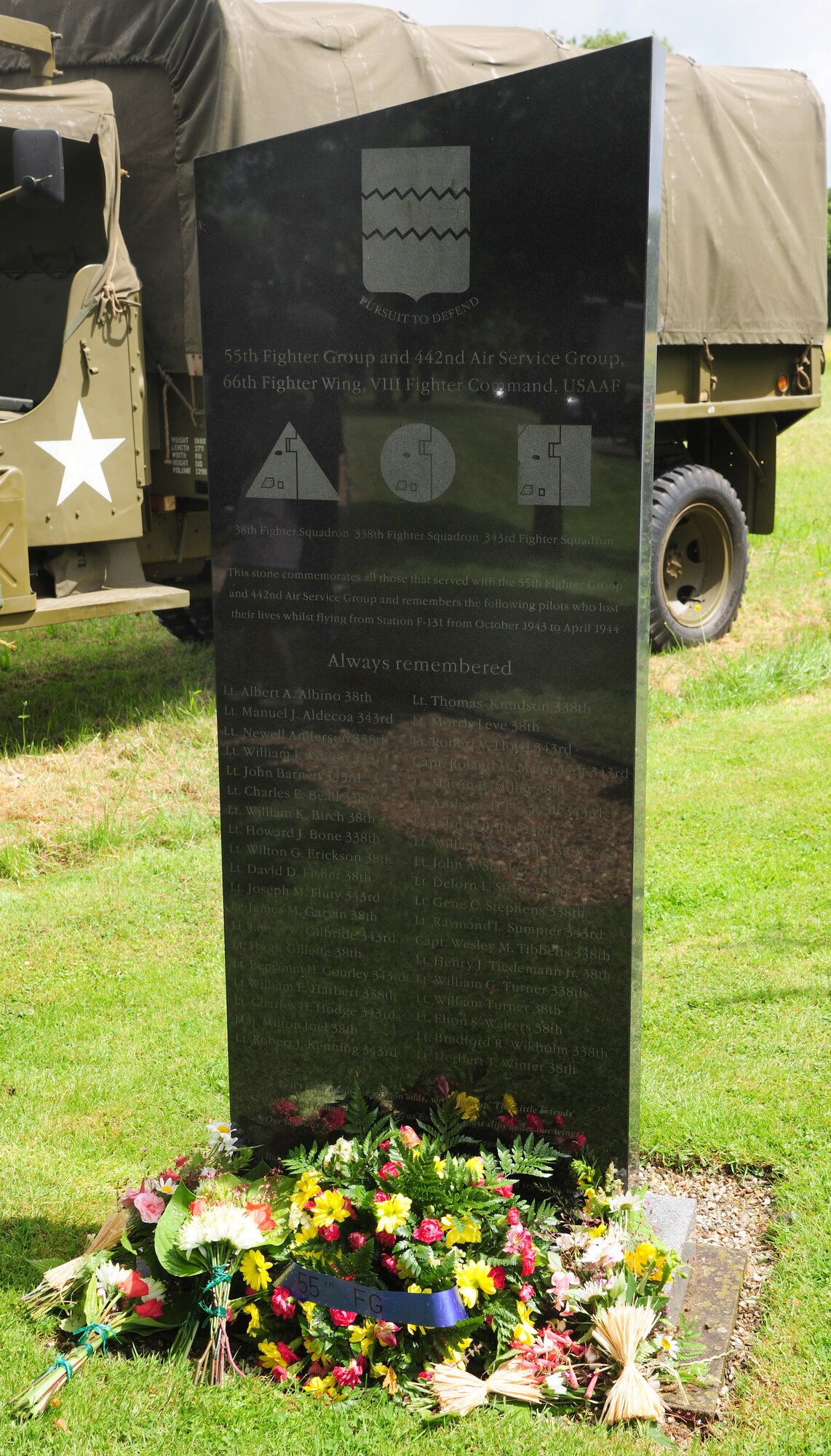 Flowers and a wreath lay at the foot of a memorial dedicated to the men of the 55th Fighter Group and the 442nd Air Service Group, June 14, 2014, near the Woodman Inn, Nuthampstead, England. From October 1943 to April 1944, 38 pilots lost their lives while flying from Station F-131. (U.S. Air Force photo/Staff Sgt. Rachel Waller/Released)