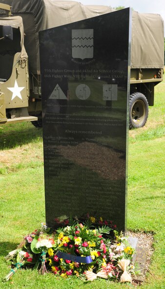 Flowers and a wreath lay at the foot of a memorial dedicated to the men of the 55th Fighter Group and the 442nd Air Service Group, June 14, 2014, near the Woodman Inn, Nuthampstead, England. From October 1943 to April 1944, 38 pilots lost their lives while flying from Station F-131. (U.S. Air Force photo/Staff Sgt. Rachel Waller/Released)