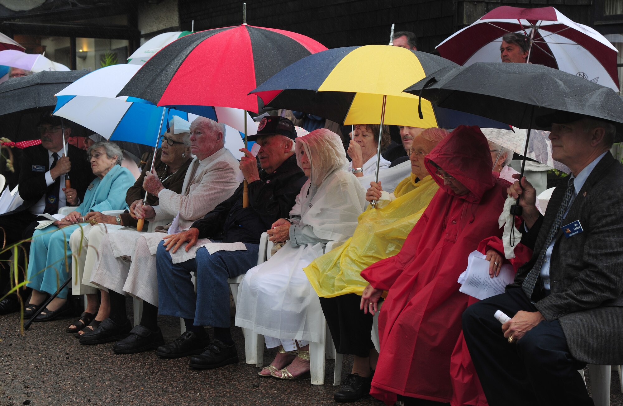 Veterans and family members from the 398th Bombardment Group (Heavy) listen to a Service of Commemoration June 14, 2014, at the Woodman Inn, Nuthampstead, England. The service was held in honor of the men from the 398th BG and the 55th Fighter Group who lost their lives during World War II. (U.S. Air Force photo/Staff Sgt. Rachel Waller/Released)