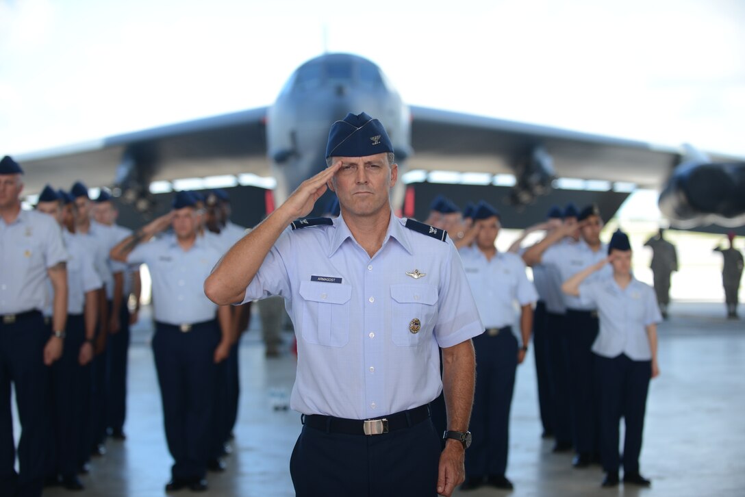Col. Jason Armagost, 36th Wing vice commander, renders a final salute to Brig. Gen. Steven Garland, former 36th Wing commander, during the 36th Wing change of command ceremony June 19, 2014 on Andersen Air  Force Base, Guam. The salute is part of a time-honored tradition where the former commander salutes a formation of Airmen representing the entire organization for the final time. (U.S. Air Force photo by Airman 1st Class Adarius D. Petty/Released)