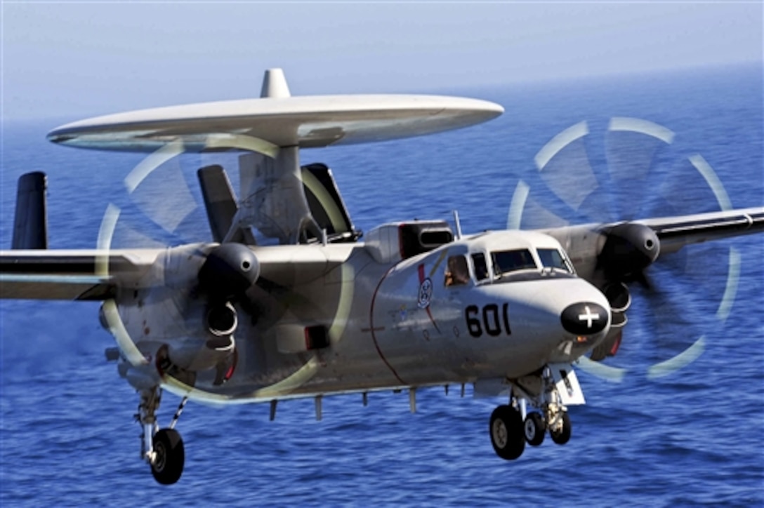 An E-2C Hawkeye prepares to land aboard the aircraft carrier USS George H.W. Bush in the Persian Gulf, June 16, 2014. Defense Secretary Chuck Hagel ordered the carrier to move from the North Arabian Sea into the Arabian Gulf to provide President Barack Obama additional flexibility should military options be required to protect American lives, citizens and interests in Iraq, Pentagon Press Secretary Navy Rear Adm. John Kirby said. 