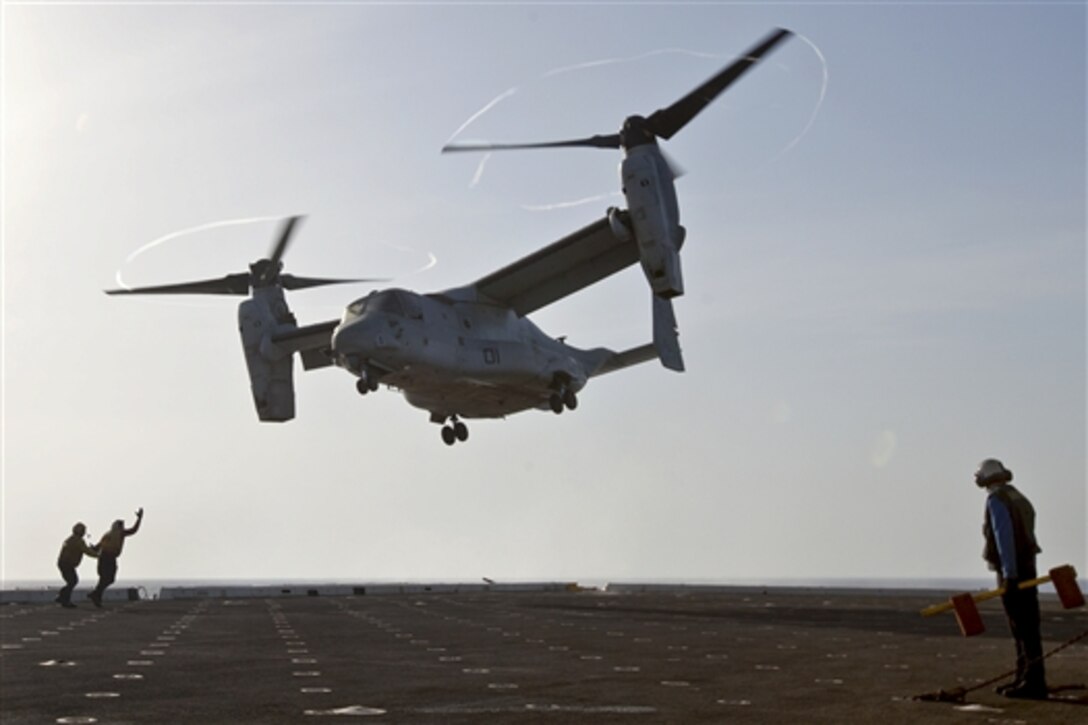 U.S. sailors aboard the amphibious transport dock ship USS Mesa Verde guide a U.S. Marine Corps MV-22 Osprey aircraft as it departs the Mesa Verde to support ongoing operations in the Persian Gulf, June 16, 2014. Defense Secretary Chuck Hagel ordered the ship into the gulf, June 16, 2014, to provide President Barack Obama additional options to protect American citizens and interests in Iraq, said Pentagon Press Secretary Navy Rear Adm. John Kirby. 