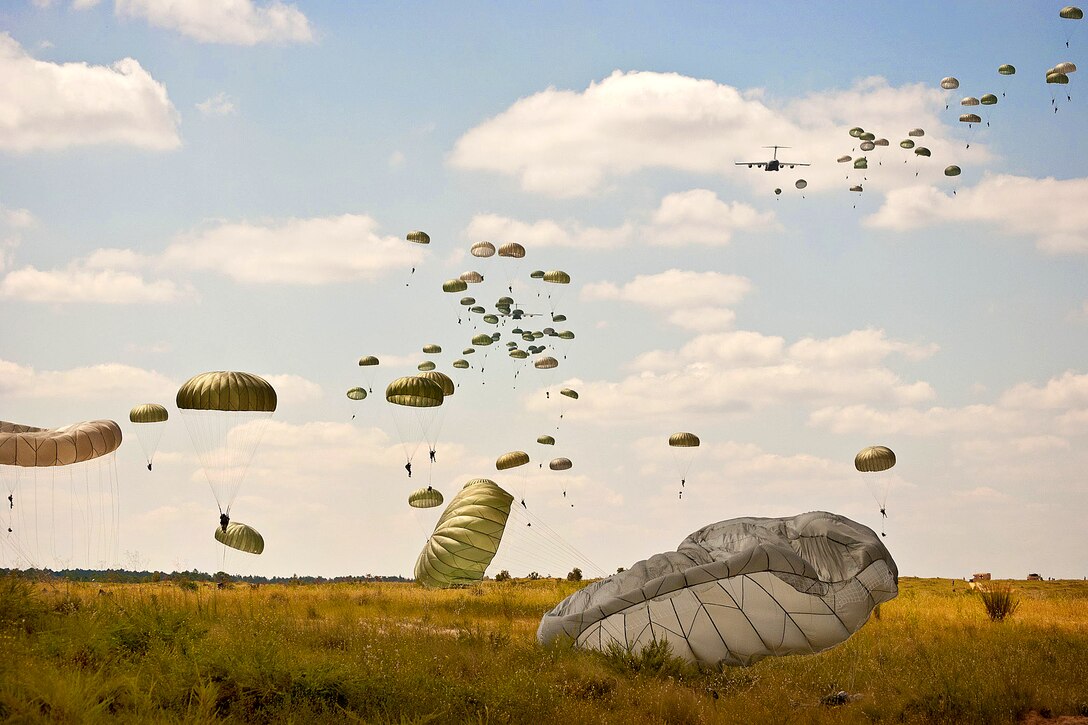 Paratroopers descend to the Sicily Drop Zone during an airborne training exercise on Fort Bragg, N.C., Sept. 8, 2011. The paratroopers are assigned to the 82nd Airborne Division's 1st Brigade Combat Team.  
