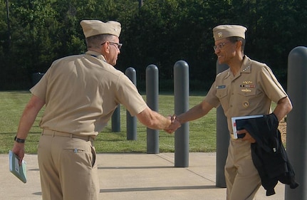 Dahlgren, Va. - Adm. Cecil D. Haney, commander U.S. Strategic Command, is greeted by Capt. Chandler Swallow, commander Joint Warfare Analysis Center, upon his arrival June 19 for a command visit and opportunity to discuss the mission with the men and women of JWAC. JWAC, a functional component of USSTRATCOM, is a premier science and engineering institution tasked with solving complex challenges for U.S. warfighters. JWAC supports USSTRATCOM's strategic deterrence missions by providing precise technical solutions to carry out national security and military strategies of the United States.