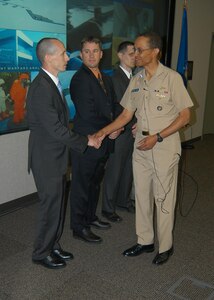 Dahlgren, Va. - Adm. Cecil D. Haney, commander U.S. Strategic Command, recognizes members of the Joint Warfare Analysis Center June 19 for their efforts in support of USSTRATCOM's missions. JWAC, a functional component of USSTRATCOM, is a premier science and engineering institution tasked with solving complex challenges for U.S. warfighters. JWAC supports USSTRATCOM's strategic deterrence missions by providing precise technical solutions to carry out national security and military strategies of the United States.