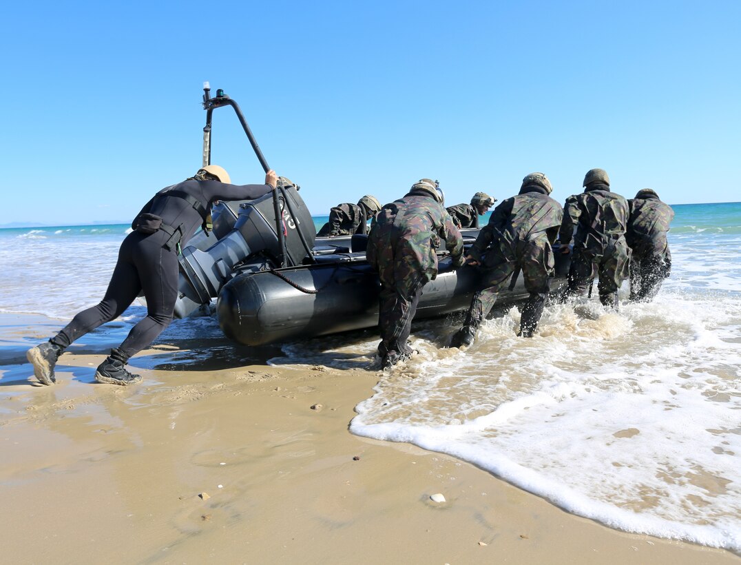 U.S. Marines of Special-Purpose Marine Air-Ground Task Force Crisis Response, Third Battalion Eight Marines, 2nd Platoon, Kilo Company, participate in a bilateral training exercise involving beach landing craft with the Spanish Marines in Sierra Del Retin, Spain, June 2, 2014. The bilateral training was conducted to further partnerships between SP-MAGTF CR and the European forces. (U.S. Marine Corps photo by Lance Cpl. Alexander Hill/Released)