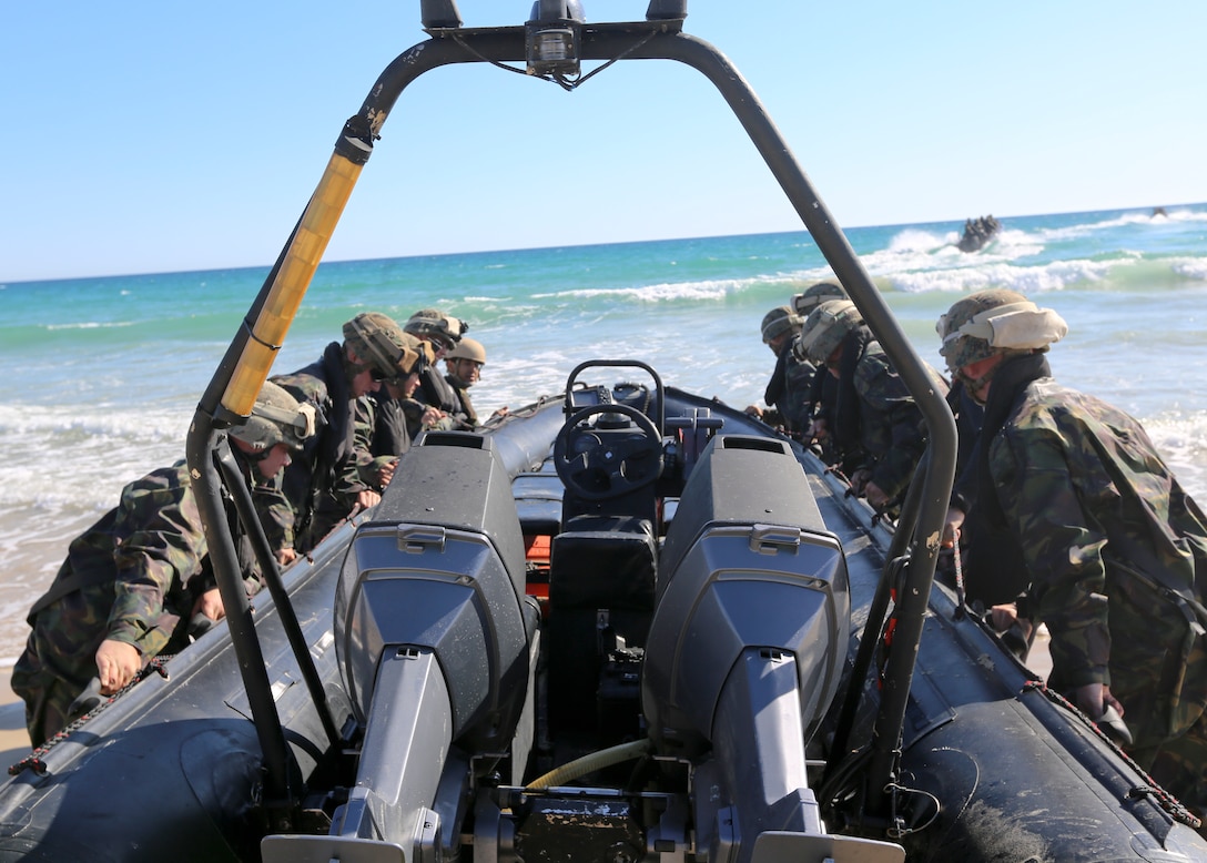 U.S. Marines of Special-Purpose Marine Air-Ground Task Force Crisis Response, Third Battalion Eight Marines, 2nd Platoon, Kilo Company, participate in a bilateral training exercise involving beach landing craft with the Spanish Marines in Sierra Del Retin, Spain, June 2, 2014. The bilateral training was conducted to further partnerships between SP-MAGTF CR and the European forces. (U.S. Marine Corps photo by Lance Cpl. Alexander Hill/Released)
