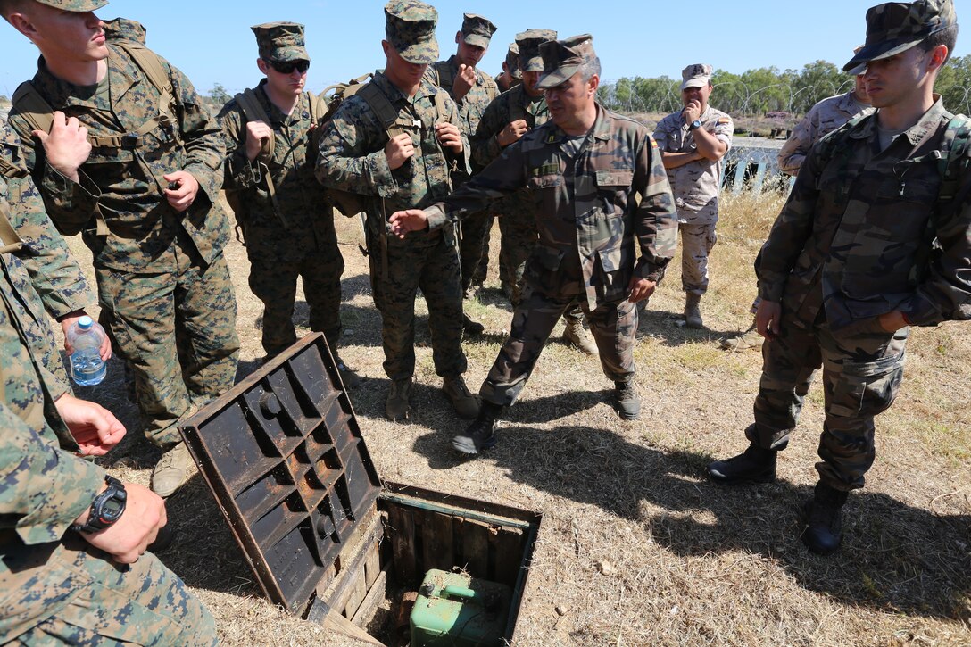 Spanish Marine Capt. Martin Morillo provides training on improvised explosive devices to U.S. Marines with Special-Purpose Marine Air-Ground Task Force Crisis Response in Sierra del Retin, Spain, June 3, 2014. The training was conducted by the Spanish and American forces in an effort to demonstrate their commitment to military friendship, strategic partnership and regional and global security. (U.S. Marine Corps photo by Lance Cpl. Alexander Hill/Released)