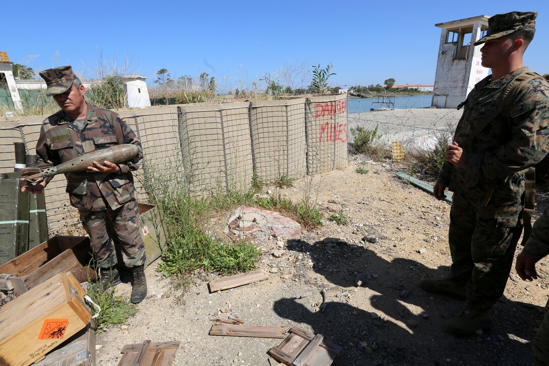 Spanish Marine Capt. Martin Morillo provides training on improvised explosive devices to U.S. Marines with Special-Purpose Marine Air-Ground Task Force Crisis Response in Sierra del Retin, Spain, June 3, 2014. The training was conducted by the Spanish and American forces in an effort to demonstrate their commitment to military friendship, strategic partnership and regional and global security. (U.S. Marine Corps photo by Lance Cpl. Alexander Hill/Released)