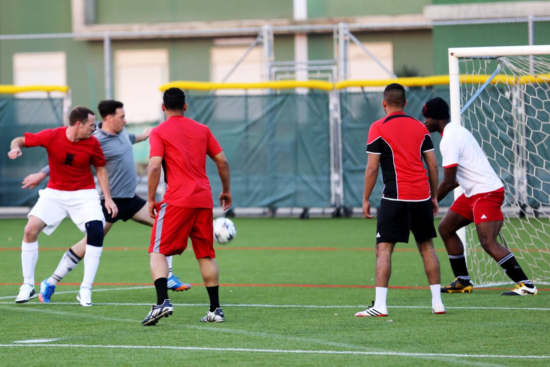 Corporal Joshua Braun (grey shirt), a ground radio technician with Special-Purpose Marine Air-Ground Task Force Africa 14, scores a goal during an intramural soccer game, April 15, 2014. He says he joined the Marine Corps because he “knew looking back on my life the one regret I would have would be to not serve in the military and I don’t like to live life with regrets. I wanted to serve my country and I wanted to be a positive influence on the men I served with."