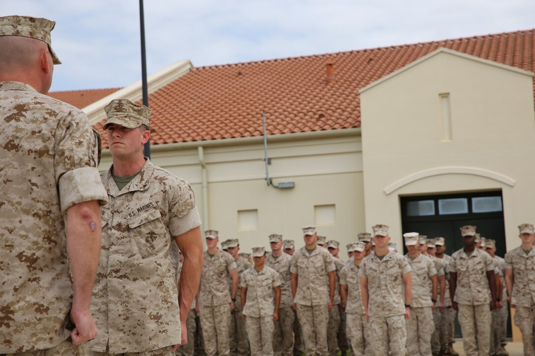 Corporal Joshua Braun, a ground radio technician with Special-Purpose Marine Air-Ground Task Force Africa 14, stands at the position of attention at his promotion ceremony, June 2, 2014. Braun was meritoriously promoted to his present rank.