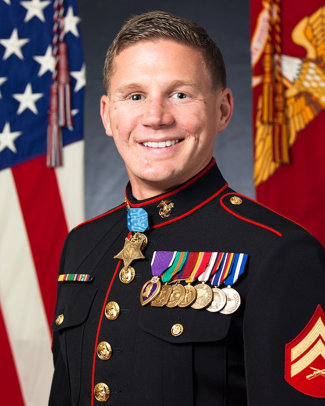 Retired U.S. Marine Corps Cpl. William Kyle Carpenter poses for his official Medal of Honor photo inside the Sheraton hotel, Arlington, Va., June 18, 2014. Cpl. Carpenter will receive the Medal for his actions while serving in Afghanistan. (U.S. Marine Corps photo by Cpl. Michael C. Guinto/Released)
