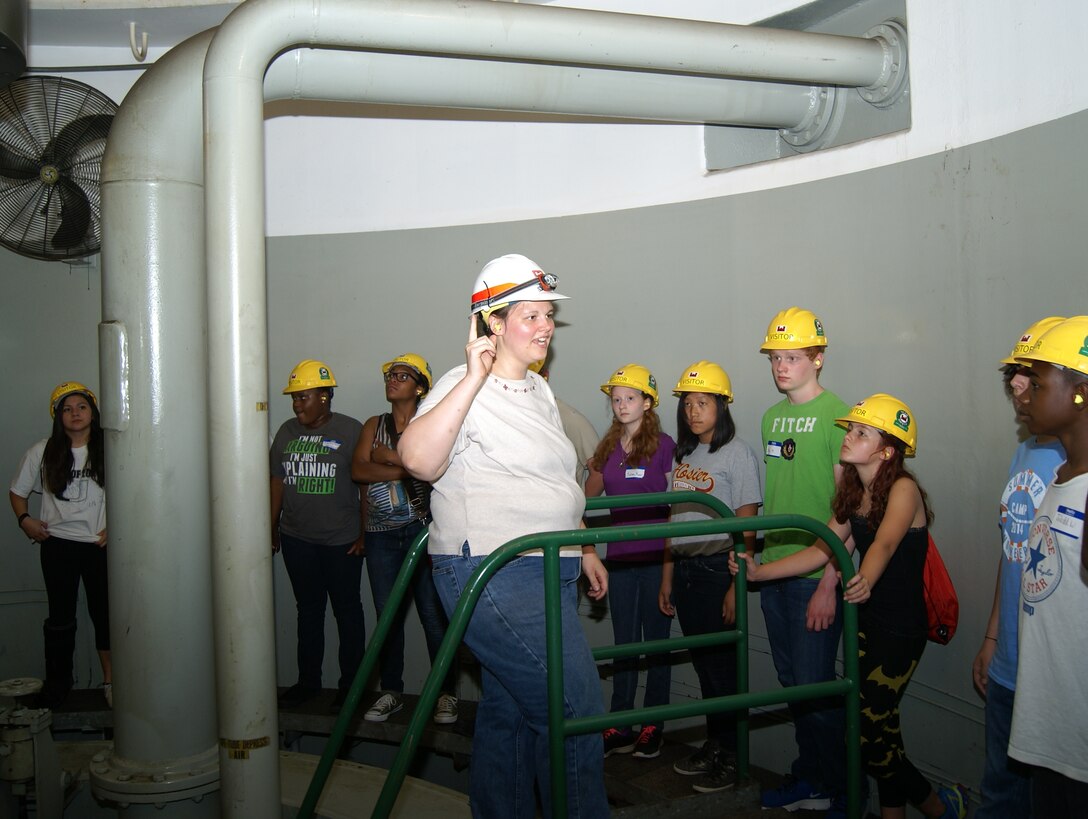 Sarah Cary, a mechanical engineer assigned to Keystone Dam with the Tulsa District U.S. Army Corps of Engineers provides a tour of the hydroelectric powerhouse to Tulsa Alliance for Engineering summer campers, June 18.