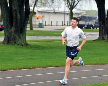 Airman 1st Class Robert Miles, assigned to the 115th Fighter Wing, Wisconsin Air National Guard, runs the 1.5 mile portion of his annual physical fitness assessment April 15, 2012. Miles is also training for the Lincoln National Guard Marathon scheduled to take place May 6 in Lincoln, Neb., for a chance to make the National Guard Marathon Team, the Guard's top runners who then travel with the team and compete in various events throughout the year.