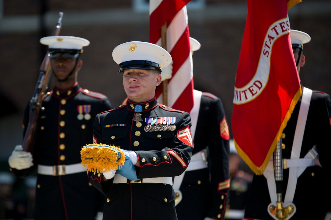 Cpl. Kyle Carpenter, Medal of Honor recipient, recieved his Medal of Honor flag during a parade in his honor at Marine Barracks Washington, D.C., June 20, 2014. Carpenter is the third Marine to recieve the Medal of Honor since the beginning of Operations Iraqi Freedom and Enduring Freedom. 